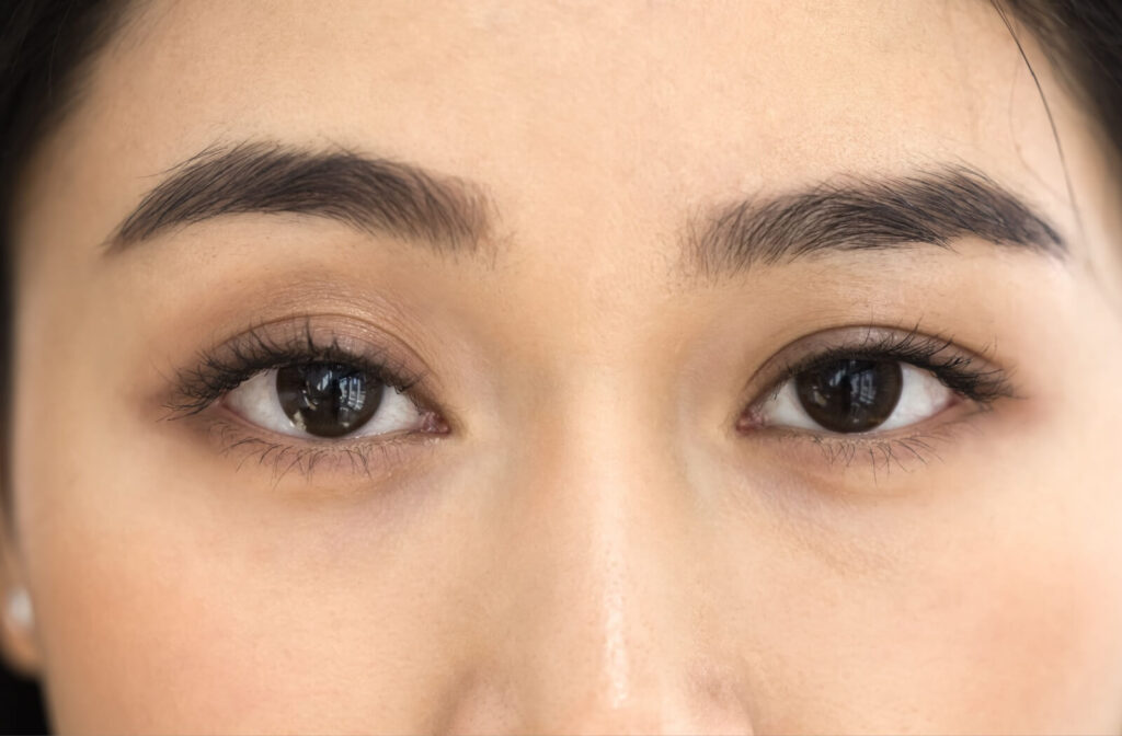 Close-up of a person’s eyes showing clear detail of the irises, eyelashes, and skin texture, emphasizing healthy eyes and natural vision clarity.